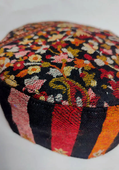 floral details and lakeer pattern on black Kashmiri lightweight cap