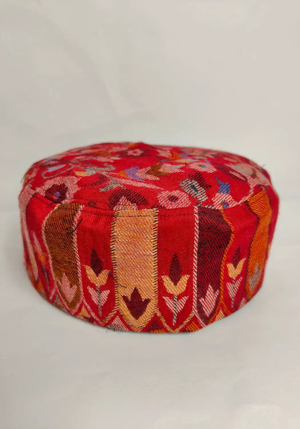 lakeer lattern on the sides of red kashmiri kani cap