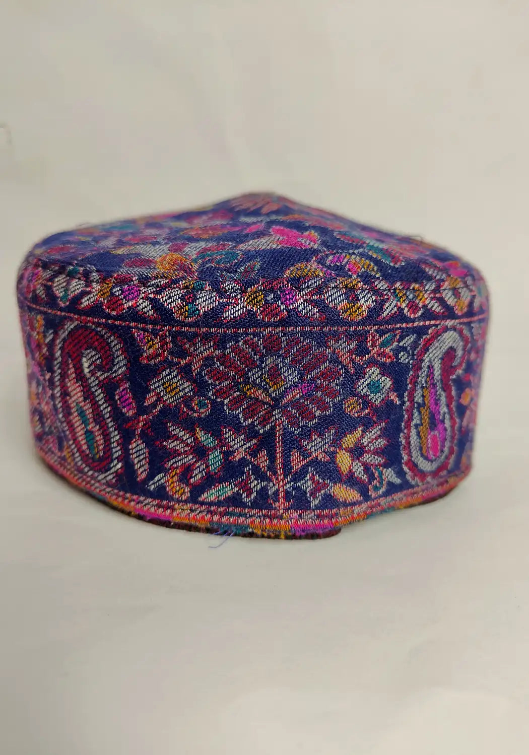 floral kani pattern on the sides of the Kashmiri classic dark blue cap