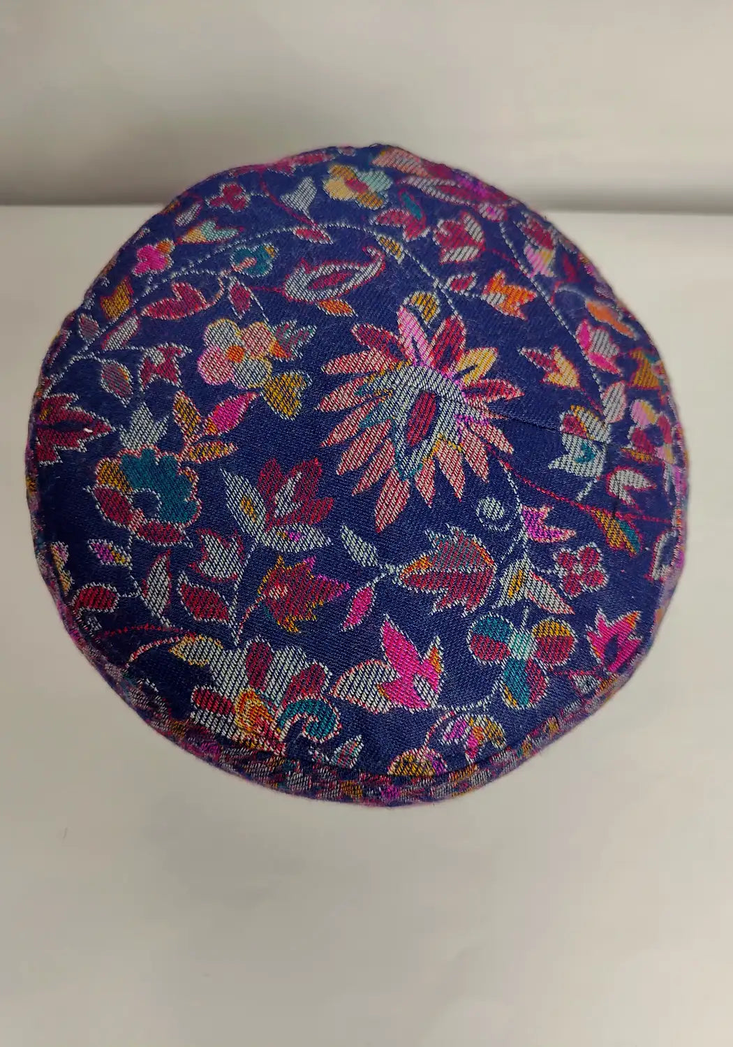 top side of Kashmiri kani cap in floral motifs 