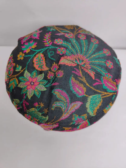 Mens cap top side from Kashmir with florals in woven kani patterns