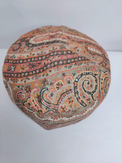 round cap with floral in kani woven patterns on top side