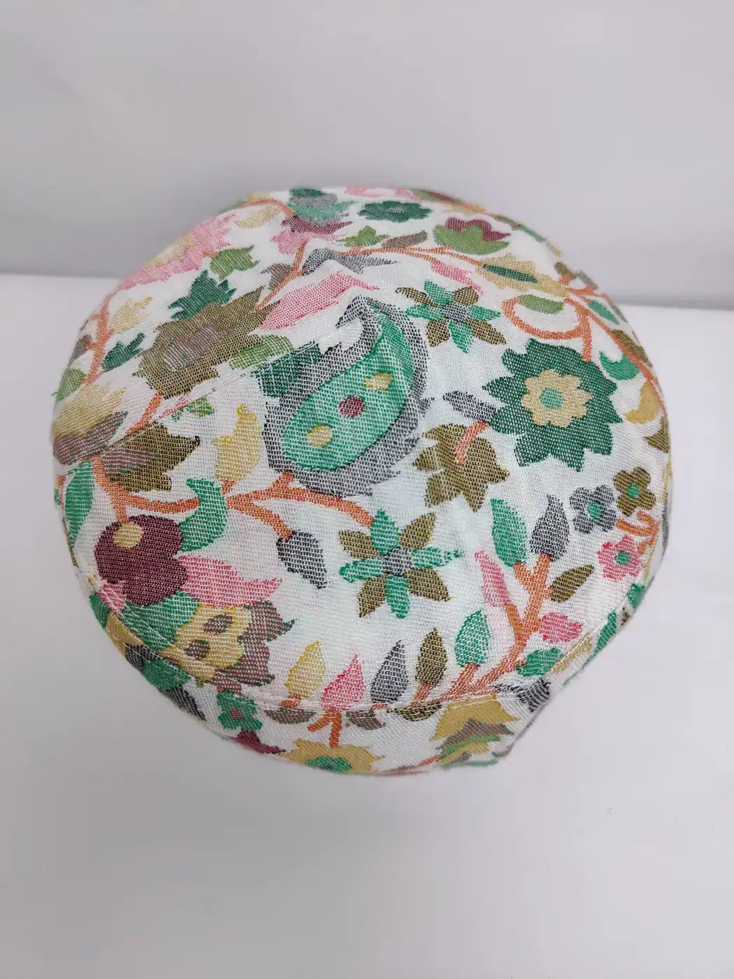 round Kashmiri cap with woven kani florals on top side