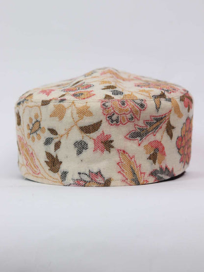 cream cap in floral woven pattern