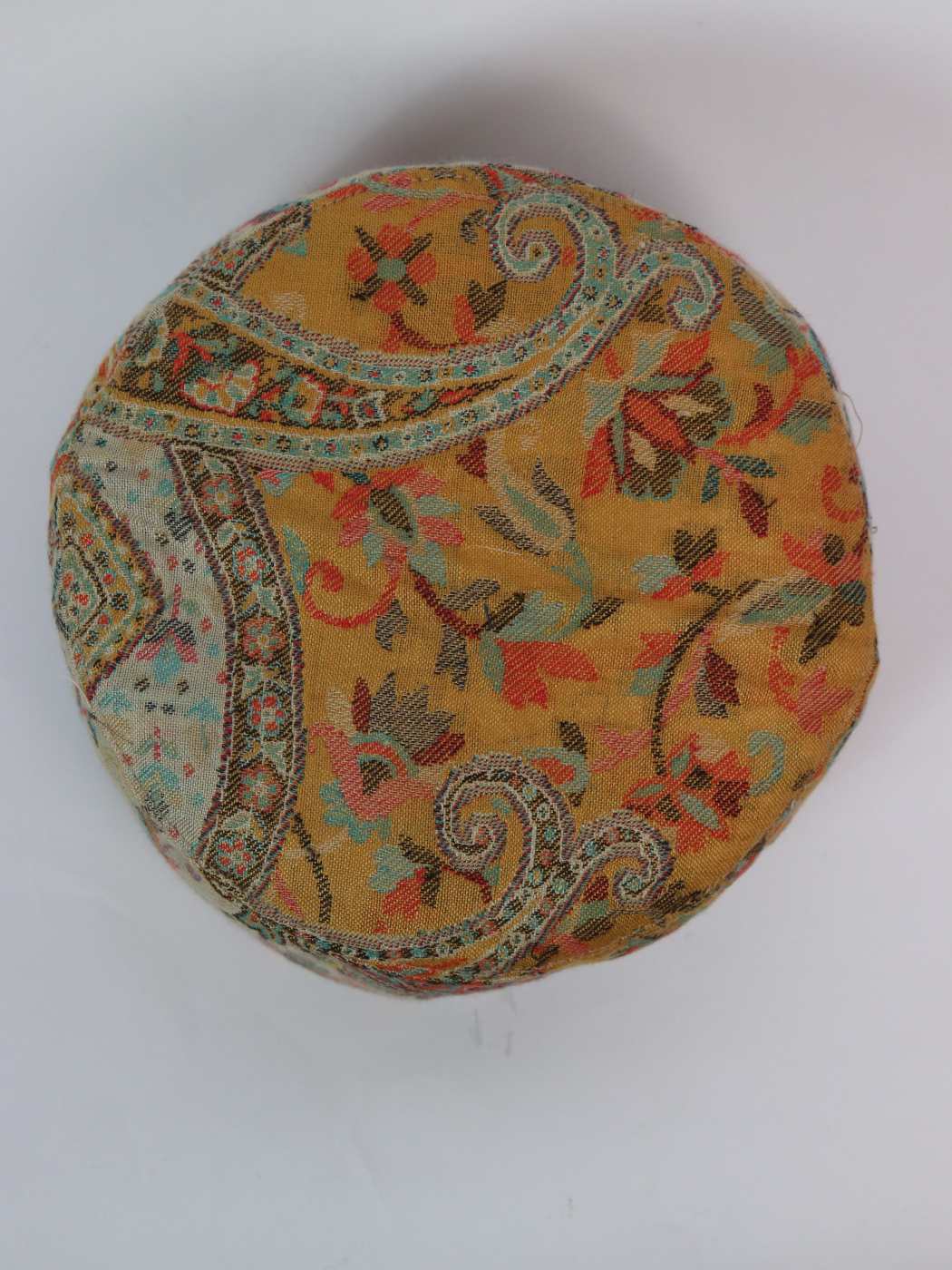round Kashmiri cap in kani wove  pattern