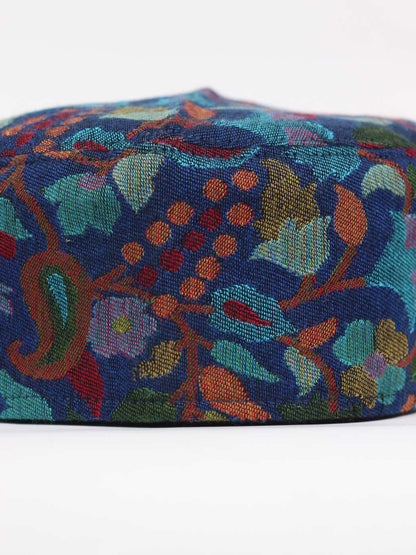 green cap in woven florals
