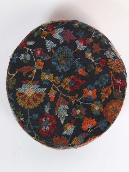 black cap in floral motifs on top side