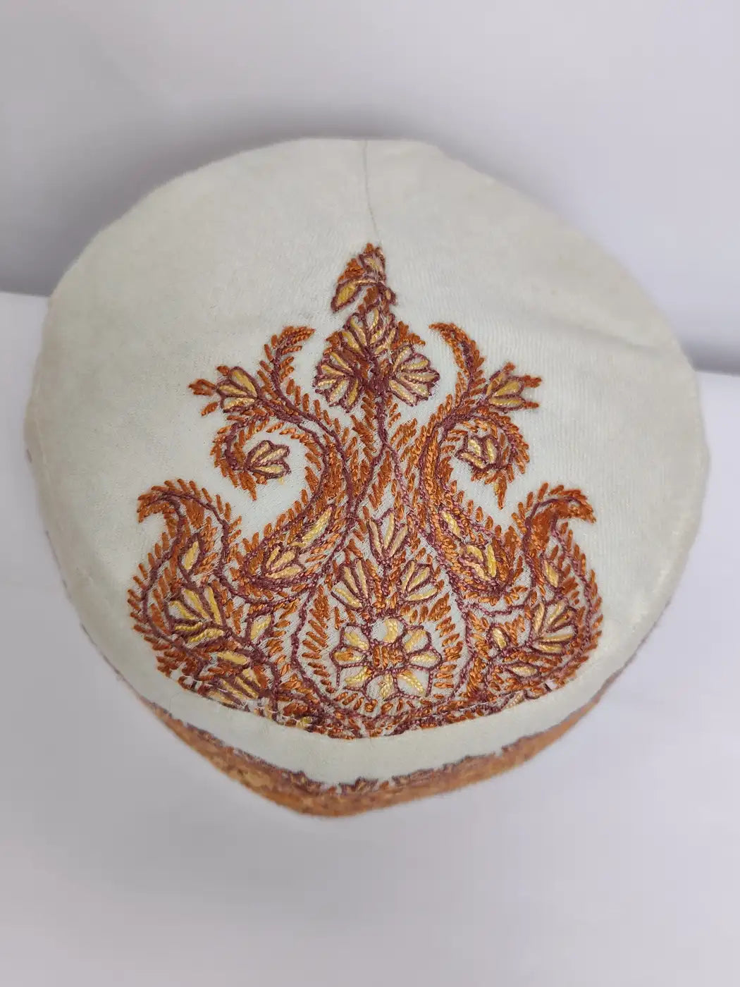Kashmiri cap in cream colour with paisley motif sozni embroidery on top side
