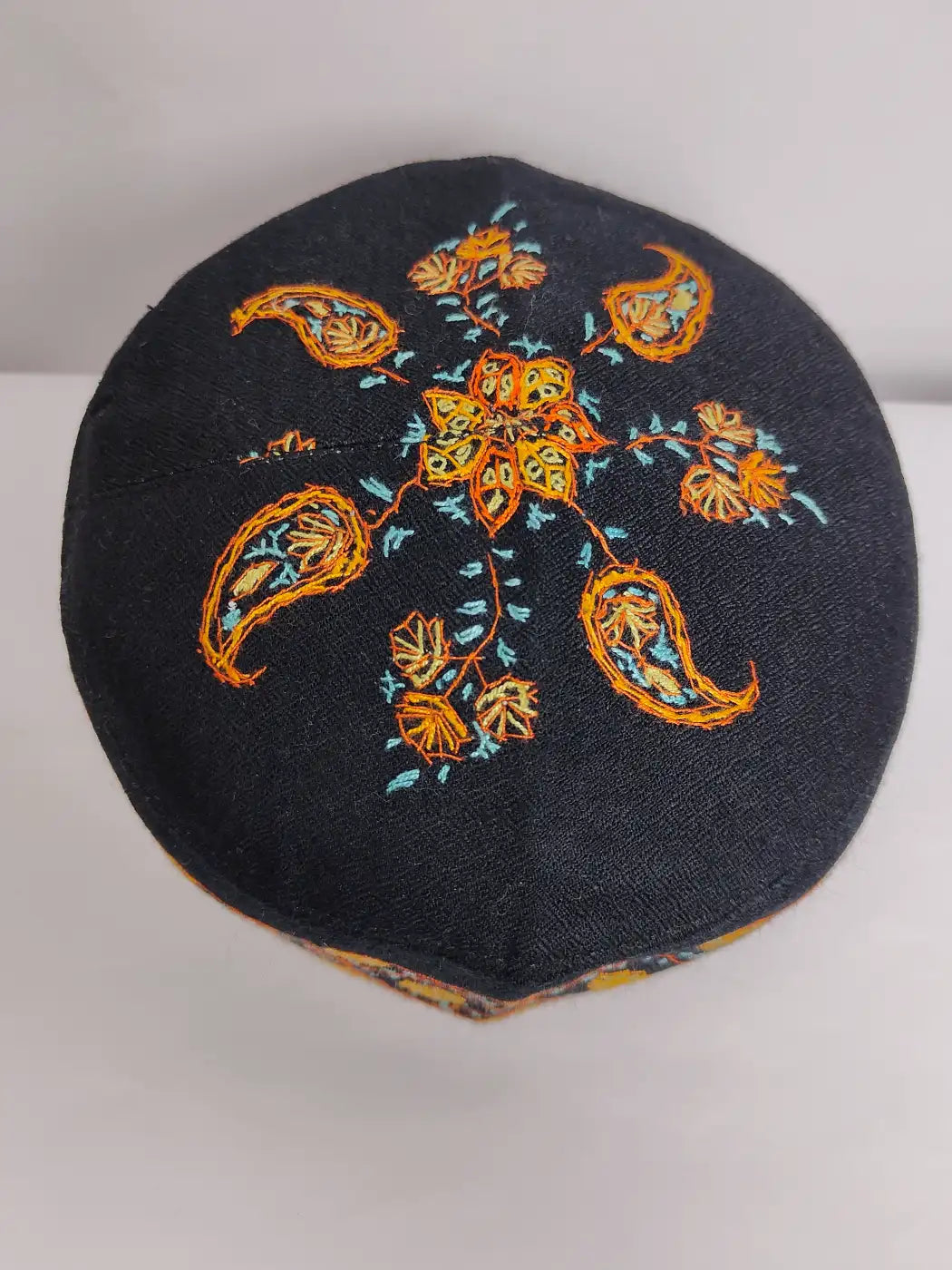 black Kashmiri cap with badam sozni embroidery on top side