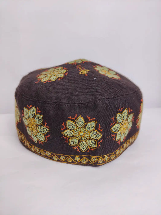 brown colour cap from Kashmir with floral motifs across sides 
