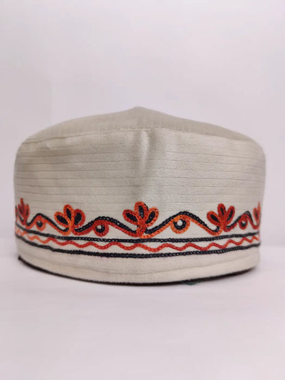 velvet cap from Kashmir with aari work across border