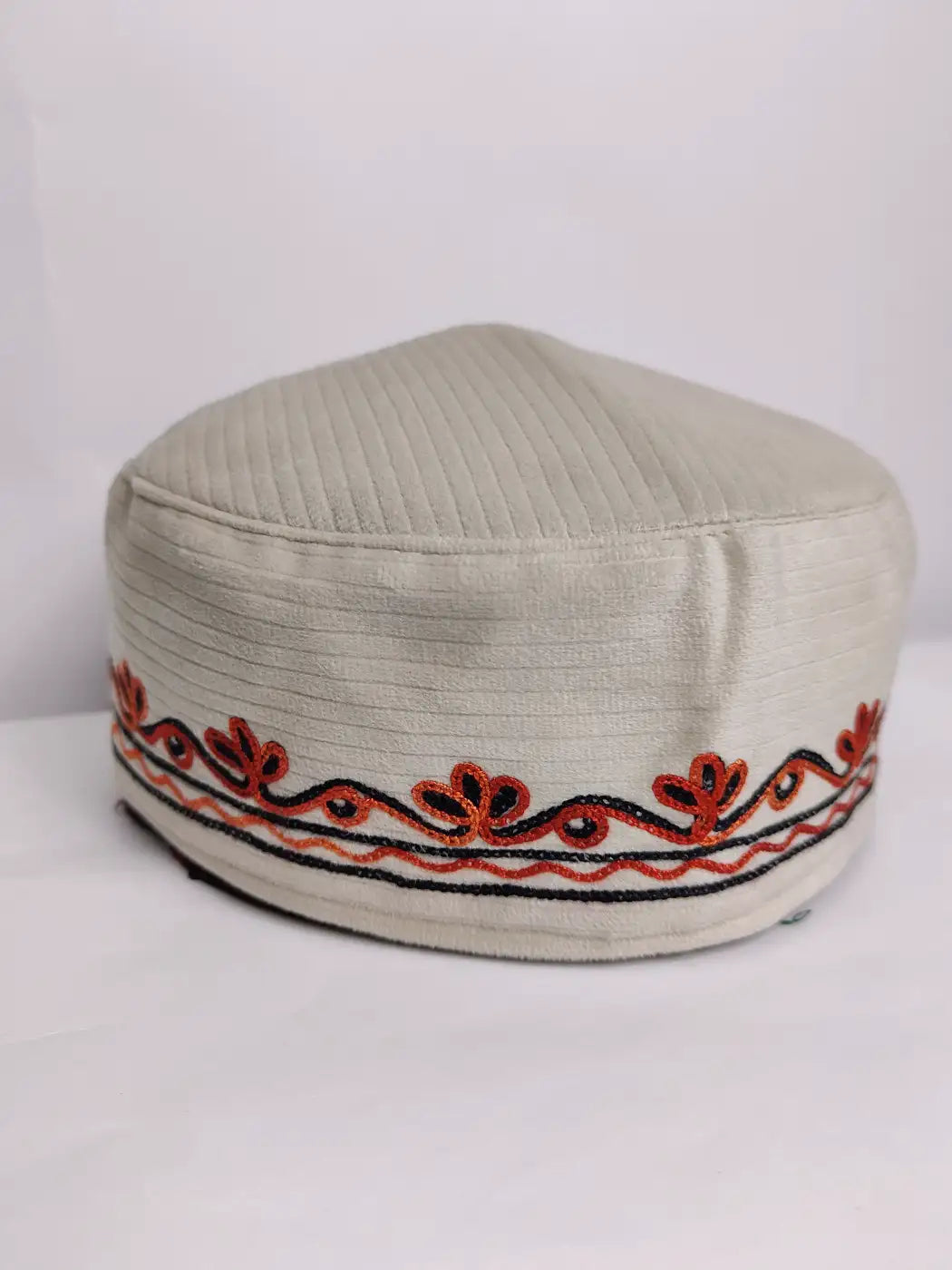 white cap in velvet with aari work