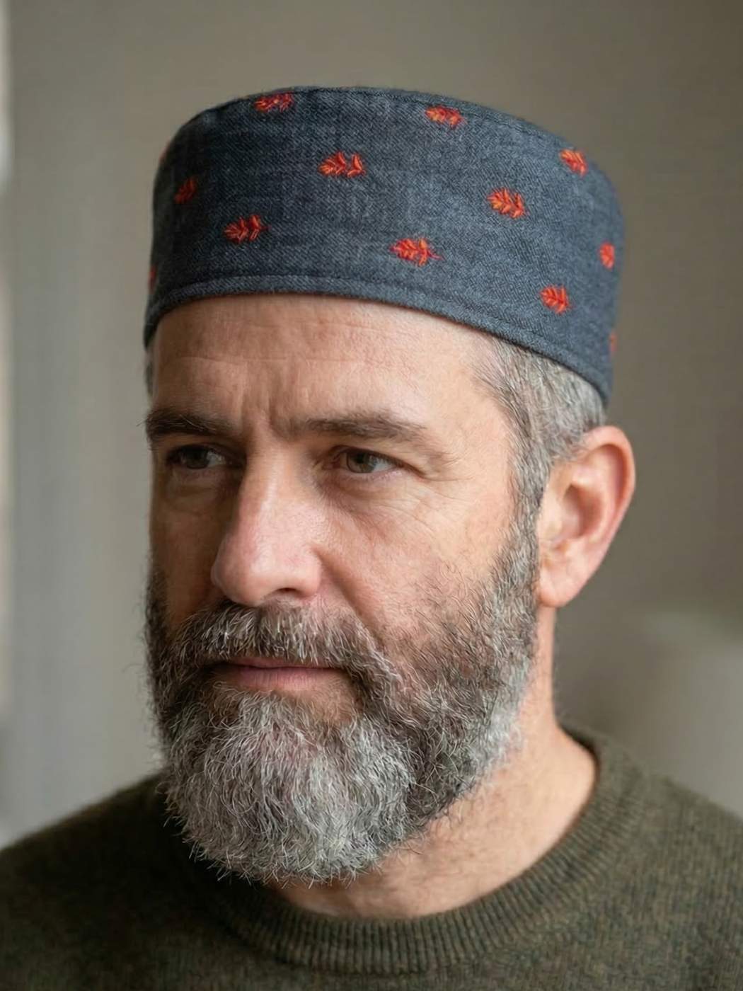 grey colour cap with hand sozni booti style embroidery 