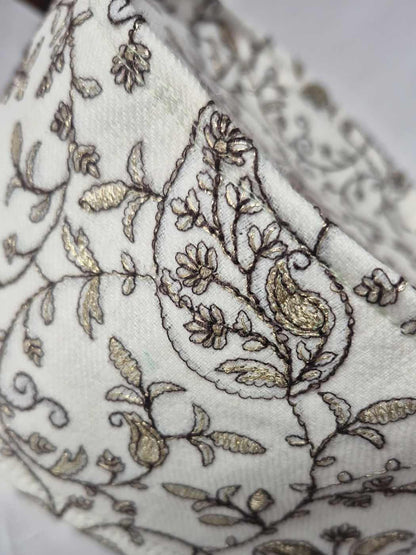 omani style cap with intricate zari tilla embroidery in clear paisley or badam pattern