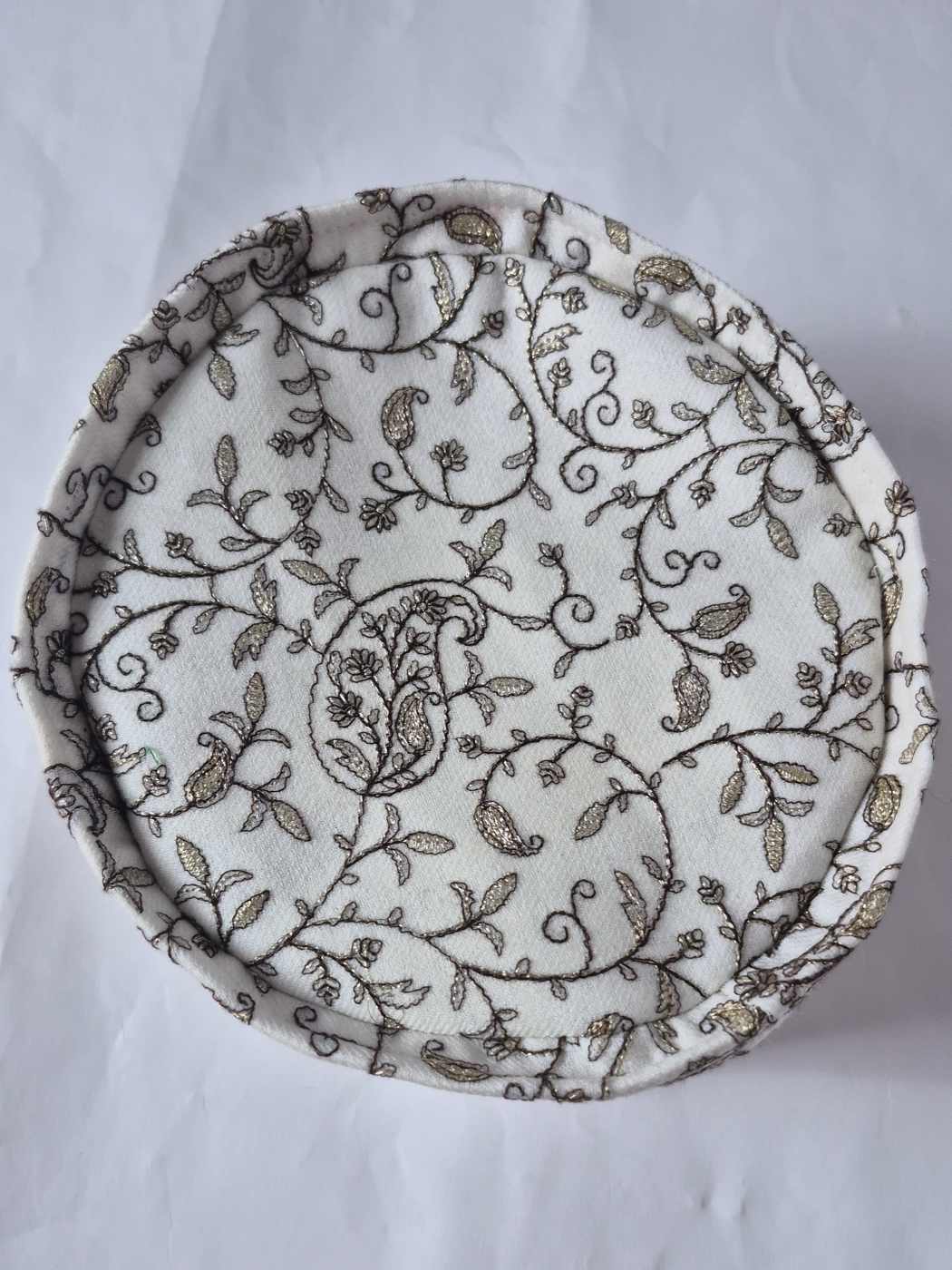 top of the white omani style cap with paisley zari embroidery 