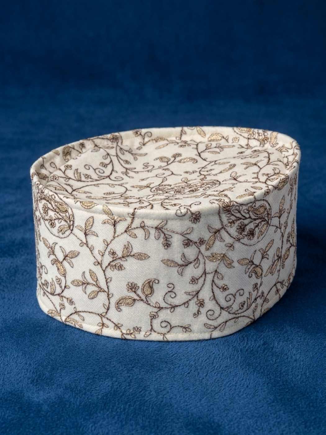 White Kashmiri omani style cap with paisley pattern in zari tilla work