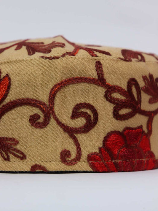 beige cap in polywool with aari embroidery 