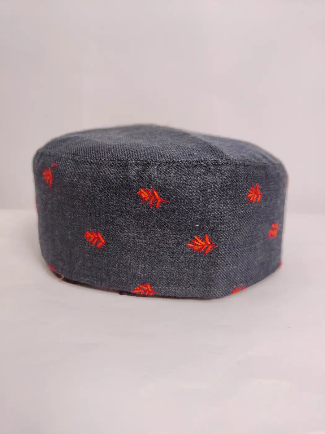 Black Kashmiri cap unique with booti style sozni embroidery on sides 