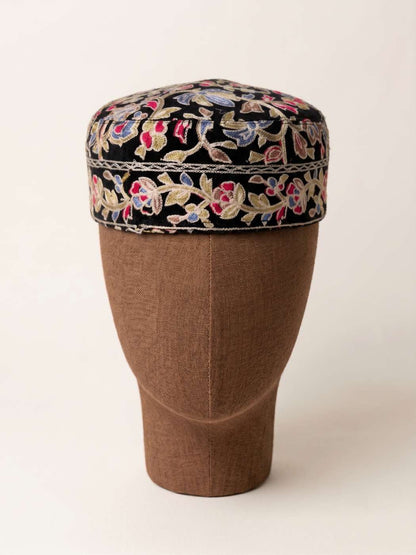 nlack cap with all-over embroidery