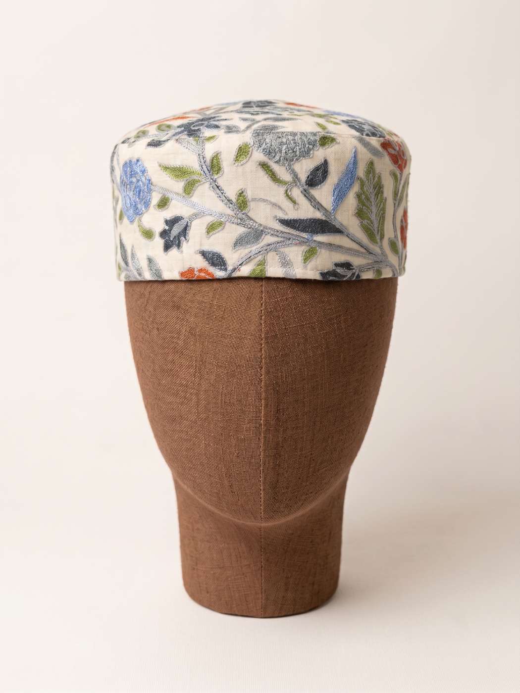 cream colour cap with all over work