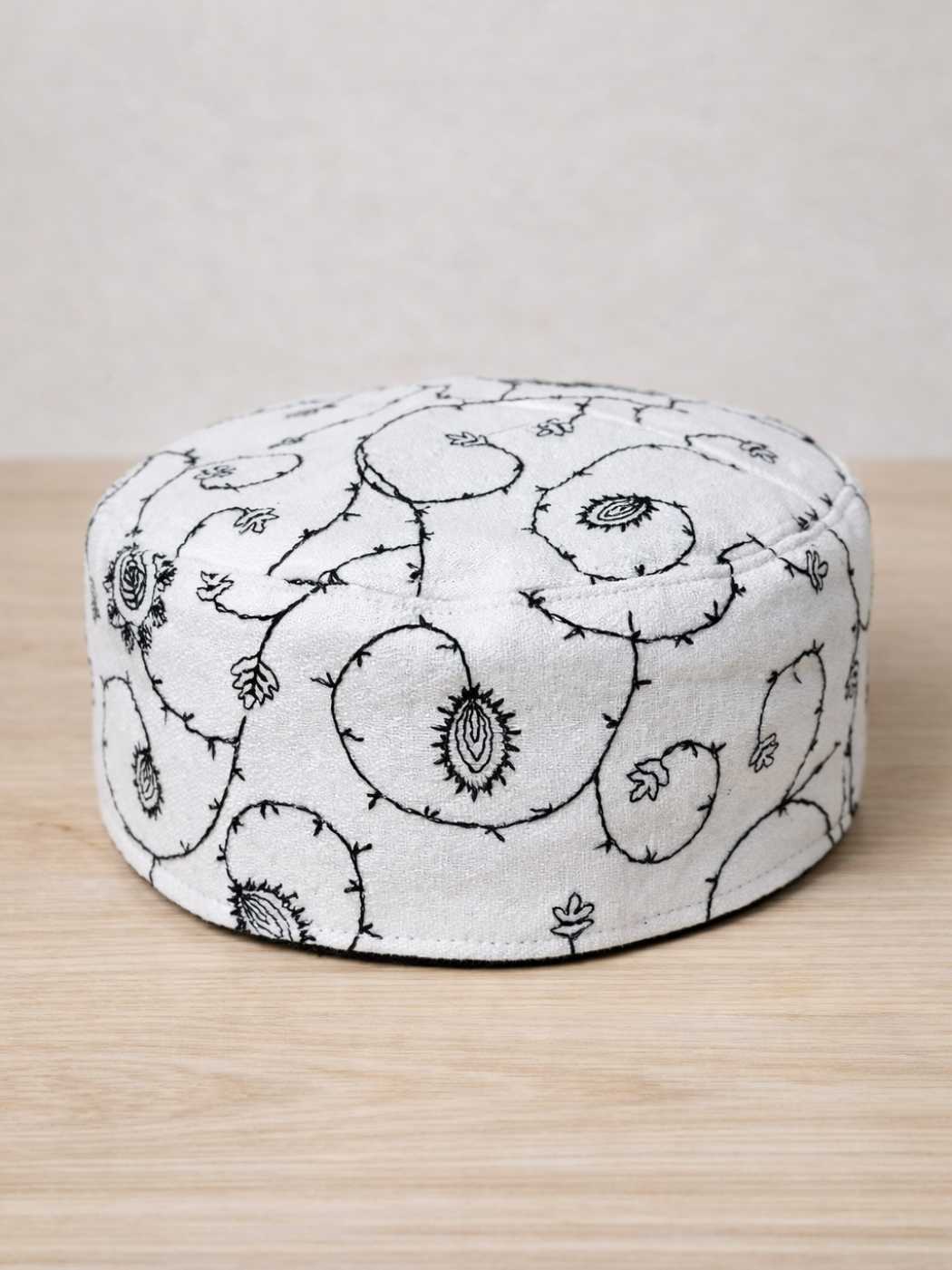 all over work white cap in sozni embroidery
