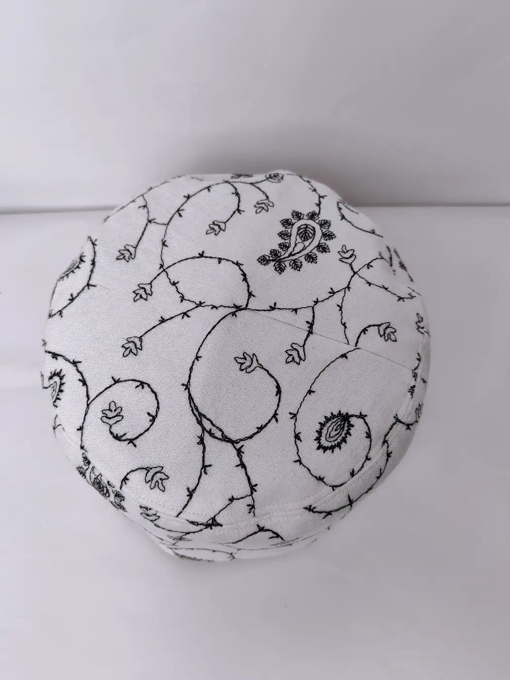 Kashmiri white cap top side
